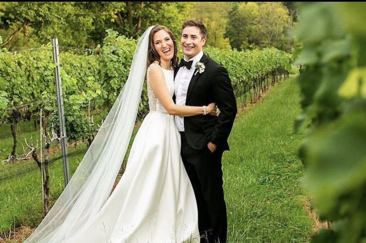 Betsy Woodruff with her husband on their wedding day.